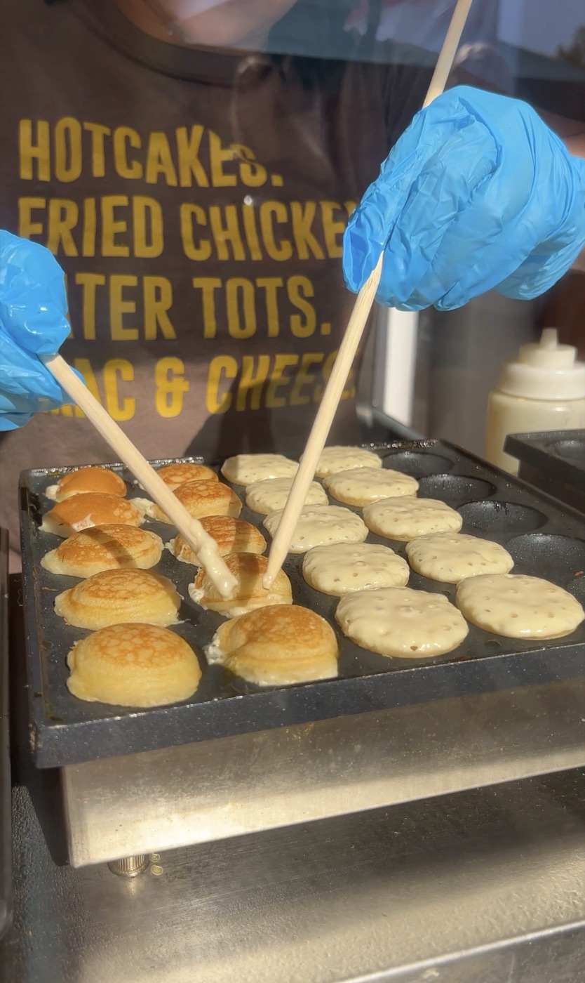 Mini pancakes cooking on the griddle at Hot Chix Hotcakes and Chicken at the NC State Fair